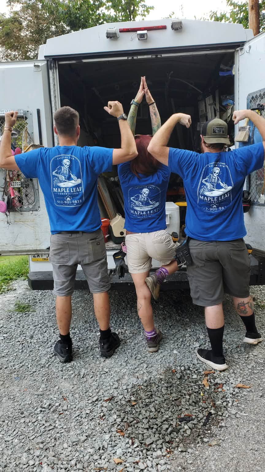 The Maple Leaf Contracting crew showing the company logos on their shirts