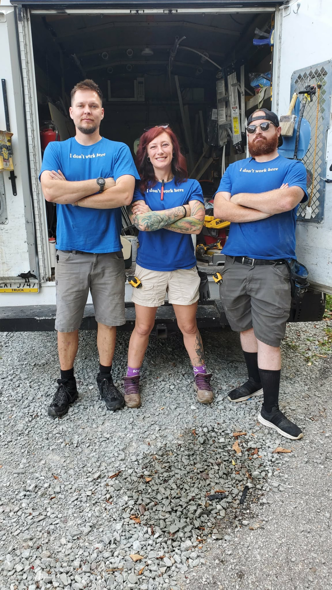 The Maple Leaf Contracting crew standing in front of the work truck